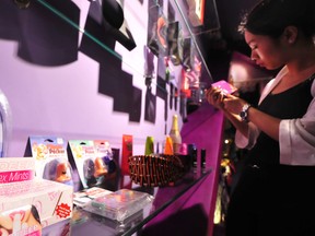 A woman browses for sex toys at a (non-Walmart) store.