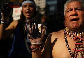 Protesters demonstrate in front of a United States courthouse against Chevron on Oct. 15, 2013 in New York City.