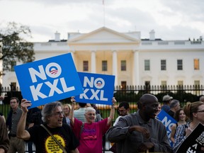 Demonstrators, celebrating U.S. President Barack Obama's blocking of the Keystone XL oil pipeline, rally in front of the White House in Washington, D.C. on November 6, 2015.