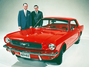 Lee Iacocca, left, and Don Frey pictured with an early Mustang.