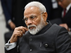 India's Prime Minister Narendra Modi attends a meeting with US President Donald Trump and Japanese Prime Minister Shinzo during the G20 Osaka Summit in Osaka on June 28, 2019.