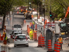 Road repairs on a Montreal street. William Watson argues that it would be better if repair and maintenance were done in a way that took into account the costs they impose on people just trying to get around.