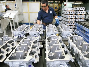 Ford Motor Co. cylinder heads are inspected at the Nemak plant in Monterrey, Mexico. Nemak is closing its Windsor plant.