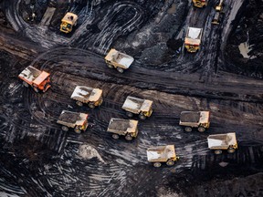 Heavy haulers are seen at the Suncor Energy Inc. Fort Hills mine in this aerial photograph taken above the Athabasca oilsands near Fort McMurray, Alberta.