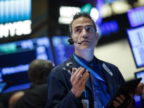 A trader works on the floor of the New York Stock Exchange.