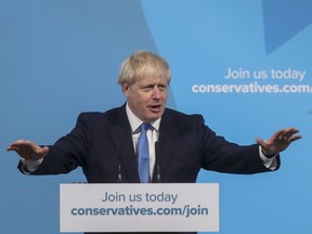 Boris Johnson, leader of the Conservative Party, gestures as he makes a speech as he is announced the winner of the Conservative Party leadership contest at the Queen Elizabeth II Conference Centre in London, U.K.