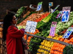 A customer looks at fruits and vegetables at the Central Market in Tapiales, greater Buenos Aires, Argentina, on August 8, 2019.