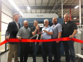 The team at PaperWorks celebrates a special ribbon-cutting event to mark the official start of the company's latest capital equipment investments: a Koenig & Bauer Rapida 145 57-inch seven-color press along with two new Koenig & Bauer-Iberica 144K die cutters at the Baldwinsville, NY facility. Left to right: Zack Hall, Vice President Packaging Operations; Tony Foti, Director, Project Management; Shelby Jacobsen, Southside Production Manager; Don Gray, Director of Engineering; Jason Barber, Litho Process Engineer; and Bill Lennox, Vice President & General Manager, Northeast Packaging Operations.