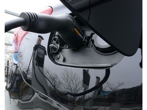 A car is charged at a charge station for electric vehicles on Parliament Hill in Ottawa on Wednesday, May 1, 2019. Transport Canada data shows more than 14,000 electric vehicles were purchased in Canada during the first three months of the federal government's new rebate program.THE CANADIAN PRESS/Sean Kilpatrick