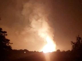 Flames light up the sky after an Enbridge gas pipeline explosion in rural Moreland, Kentucky, U.S., August 1, 2019 in this still image taken from social media video.