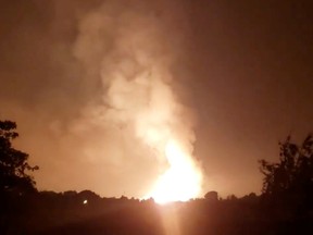 lames light up the sky after an Enbridge gas pipeline explosion in rural Kentucky, U.S., August 1, 2019 in this still image taken from social media video.