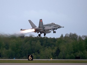 An RCAF CF-18 takes off from CFB Bagotville, Que. on Thursday, June 7, 2018.