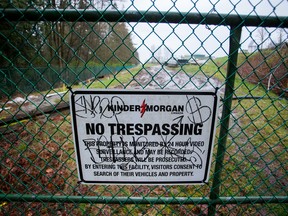 A "No Trespassing" sign is displayed on a fence outside of the Kinder Morgan Inc. facility in Burnaby, British Columbia, on Wednesday, April 11, 2018.
