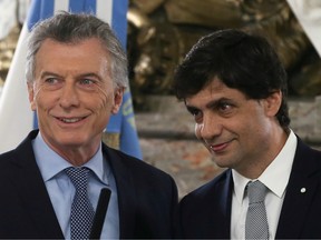 Hernan Lacunza attends his swearing-in ceremony as new economy minister next to Argentina's President Mauricio Macri at the Casa Rosada Presidential Palace in Buenos Aires, Argentina August 20, 2019.
