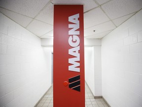 Magna International Inc. signage on display inside the company's Polycon Industries auto parts manufacturing facility in Guelph, Ont.