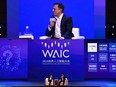 Elon Musk (R), co-founder and CEO of Tesla, and Jack Ma, co-chair of the UN High-Level Panel on Digital Cooperation, speak onstage during the the World Artificial Intelligence Conference (WAIC) in Shanghai on August 29, 2019.