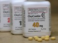 Bottles of prescription painkiller OxyContin, made by Purdue Pharma, sit on a counter at a local pharmacy in Provo, Utah, U.S., April 25, 2017.