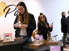 Customers and staff at the Hunny Pot Cannabis Co. retail cannabis store shop as marijuana retail sales commenced in the province of Ontario, in Toronto, Ontario, on April 1, 2019.