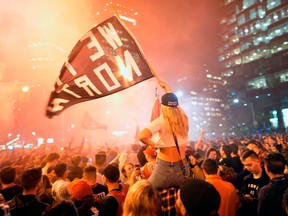 Toronto Raptors fans celebrate their win in the NBA championships in downtown Toronto, Ontario on early June 14, 2019.