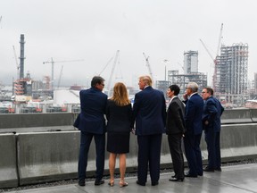 U.S. President Donald Trump (C) tours the Shell Pennsylvania Petrochemicals Complex in Monaca, Pennsylvania, on August 13, 2019.