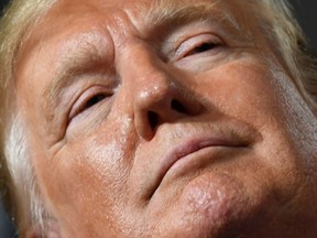 In this file photo taken on August 15, 2019, U.S. President Donald Trump speaks during a "Keep America Great" campaign rally at the SNHU Arena in Manchester, New Hampshire.