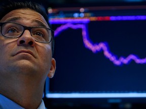 Traders work at the New York Stock Exchange (NYSE).