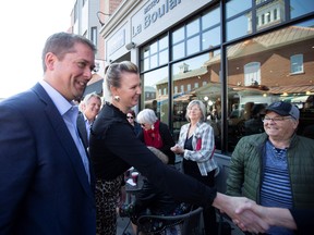 Conservative leader Andrew Scheer and his wife, Jill, campaign Monday in Ste-Hyacinthe, Quebec.