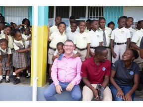 Dr. Sean Callanan, dean of Ross University School of Veterinary Medicine, meets with students at the Bronte Welsh Primary School in the Federation of St. Kitts and Nevis.