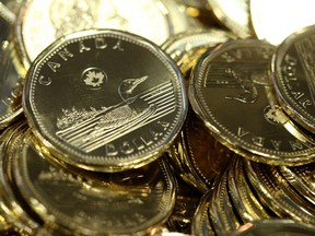 Canadian one dollar coins sit in a pile at the Royal Canadian Mint Ltd. manufacturing facility in Winnipeg, Manitoba, Canada, on Monday, March 11, 2019.