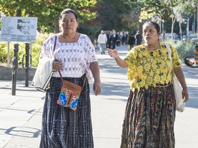 Irma Yolanda Choc Cac (right) and Angelica Choc (left) arrive at Toronto's 393 Courthouse, Tuesday September 17 regarding their case against Hudbay Minerals.