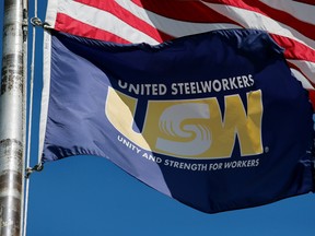 A United Steelworkers flag flies outside the Local 1299 union hall in Ecorse, Michigan, Sept. 24, 2019.