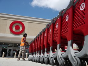 A Target store employee collects shopping carts to bring back into the store on August 21, 2019 in Pembroke Pines, Florida.