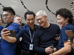 Tim Cook, chief executive officer of Apple Inc., speaks with attendees after an event in Cupertino, California, U.S., on Tuesday, Sept. 10, 2019.