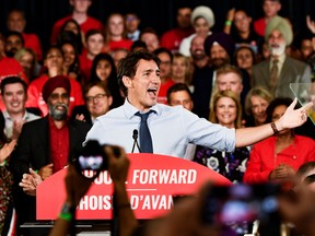 Prime Minister Justin Trudeau speaks with Liberal party supporters and volunteers after launching the election campaign at a rally in Vancouver on Wednesday.