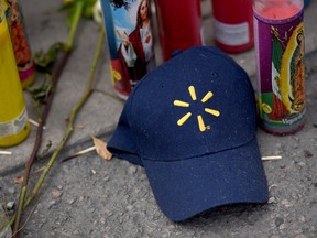 A Walmart hat sits at a memorial three days after a mass shooting at a Walmart store in El Paso, Texas, U.S. August 6, 2019.