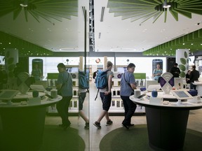 Customers at a Telus store.