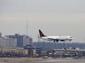 An Air Canada Boeing 737 Max 8 jet approaches Toronto Pearson International Airport for landing on March 13, 2019.