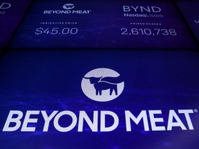 Beyond Meat’s trading information is displayed on a screen during the IPO at the Nasdaq Market site in New York in May. Tuesday the stock shed more than 20 per cent after its share lock-up was lifted.