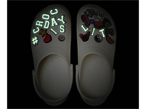 This year's limited edition #CrocDay Classic Clog will come fully loaded with a curated assortment of custom #CROCDAYISLIT Jibbitz™ charms -- some of which glow! ​