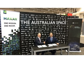 Maxar CEO Dan Jablonsky (left) signed a cooperative agreement on Oct. 22 with Anthony Murfett, Deputy Head of the Australian Space Agency.