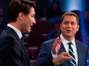 Conservative leader Andrew Scheer, right, and Liberal leader Justin Trudeau debate a point during the Federal Leaders Debate at the Canadian Museum of History in Gatineau, Quebec on Monday.