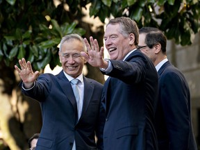 Liu He, China's vice premier, left, and Robert Lighthizer, U.S. trade representative, wave to members of the media before a meeting at the Office of the U.S. Trade Representative in Washington, D.C., U.S., on Friday, Oct. 11, 2019.