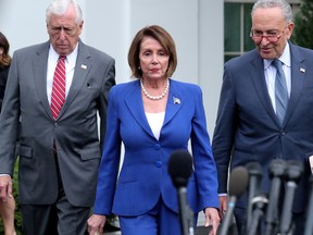 U.S. House Speaker Nancy Pelosi (D-CA) walks out with Senate Minority Leader Chuck Schumer (D-NY) and House Majority Leader Steny Hoyer (D-MD) to speak with reporters after meeting with President Trump at the White House in Washington, U.S. October 16, 2019.
