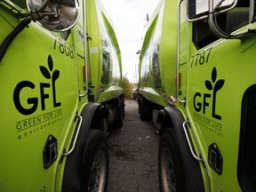 GFL Environmental Inc. garbage trucks sit parked in Toronto.