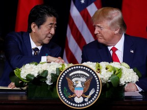 Japan's Prime Minister Shinzo Abe shakes hands with U.S. President Donald Trump during a signing ceremony on the sidelines of the 74th session of the United Nations General Assembly in New York City, New York, U.S., September 25, 2019.