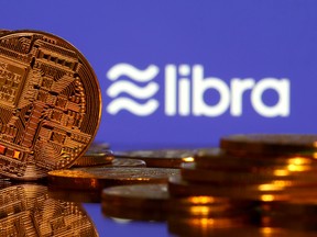 Representations of virtual currency are displayed in front of the Libra logo.