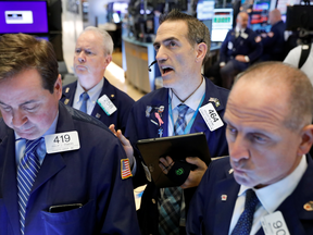 Traders work on the floor at the New York Stock Exchange on Oct. 28, 2019.
