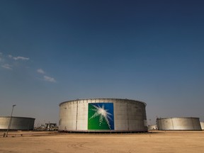 Branded oil tanks at a Saudi Aramco oil facility in Abqaiq, Saudi Arabia.
