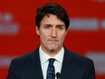 Liberal leader and Canadian Prime Minister Justin Trudeau stands on stage after the federal election at the Palais des Congres in Montreal, Oct. 22, 2019.