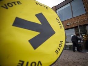 A resident enters a polling station in Toronto on Monday.